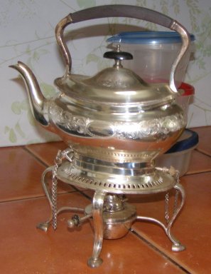 Silverplated teapot with attached stand